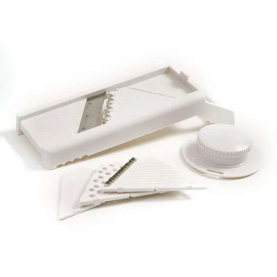 NORPRO<sup>&reg;</sup> Mandoline Slicer - Easily slice, grate or shred fruits, vegetables or meat. Includes 4 attachments with stainless steel blades as well as a safety guard. Measures: 4″ x 12″ x 4.25″ / 10cm x 30.5cm x 11cm